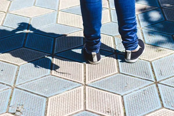 Close Shot Person Feet Wearing Jeans Black Shoes Standing Paved — Stock Photo, Image