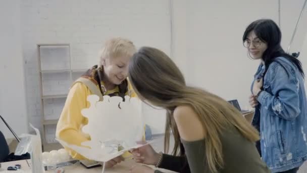 Three Designers Make Paper Construction Photosession Women Create Element Decor — Stock Video