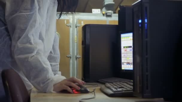 Woman check information about incubators in computer at poultry farm — Stock Video