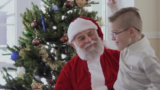 Santa Claus Red Costume White Beard Hugs Schoolboy Stripped Jacket — Stock Video