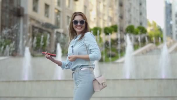 Smiling stylish woman go away from the shot — Stock Video