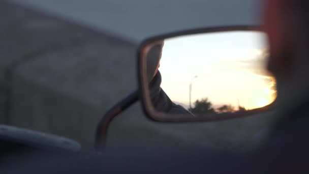 Biker looking at mirror of motorcycle — Stock Video