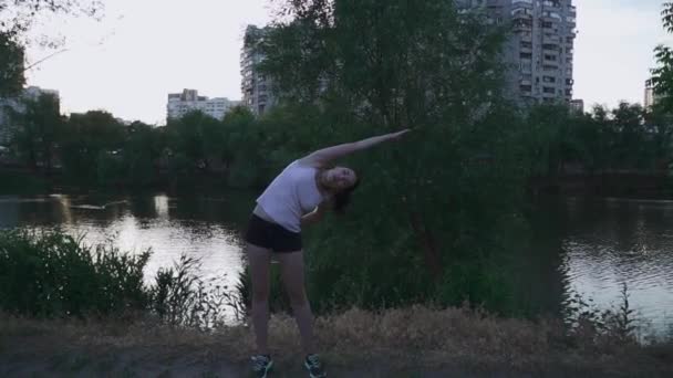 Beautiful girl doing exercises for hands — Stock Video