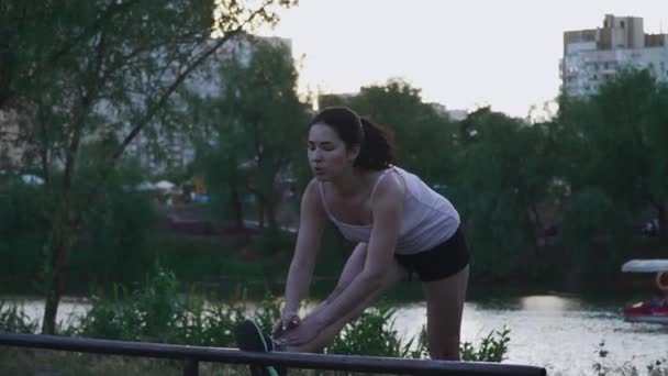 Beautiful girl doing exercise outdoors — Stock Video