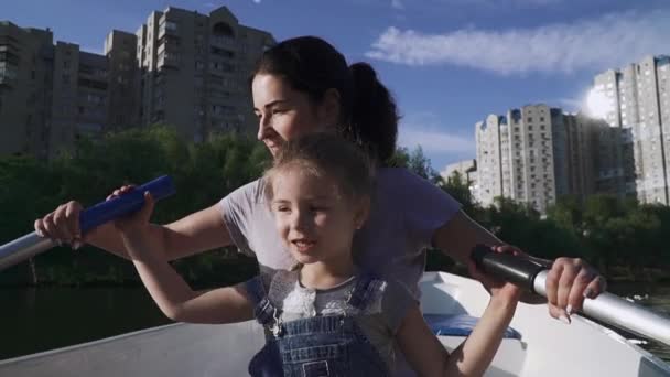 Mother and daughter rowing in the boat — Stock Video