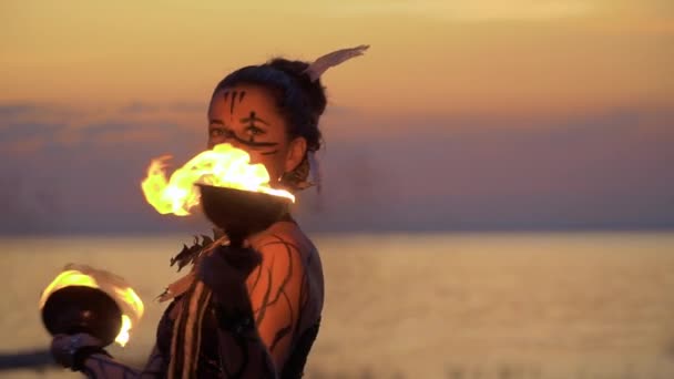 Woman near the river is dancing with fire bowls — Stock Video