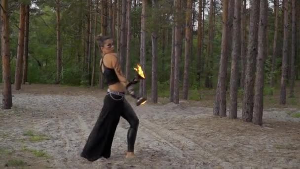 Woman in the forest is dancing with fire bowls — Stock Video