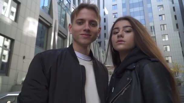 Young couple spend time with their dogs at the city — Stock Video