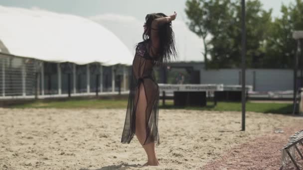 Pretty woman in silver bikini and shawl dancing on the backyard. Leisure of beautiful sensual and hot lady. Slow motion. — Stock Video