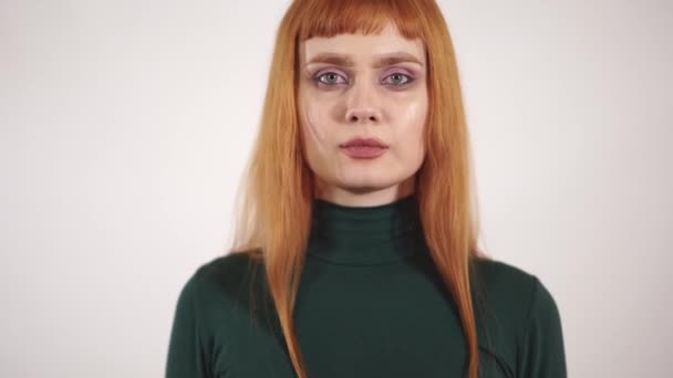 Portrait of crying beautiful woman with long hair who showing hand with red written inscription no. — Stock Video