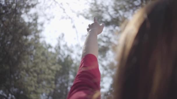 Graceful woman in the forest. Tender delicate lady raises hand in the sky. Slow motion. — Stock Video