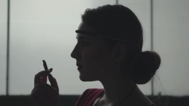 Portrait confident young woman in style cloth standing in dirty place and smoking the sigaret. Abandoned dilapidated building. — Stock Video