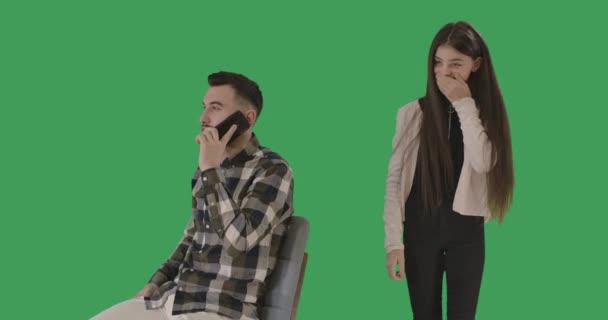 Cute teenage girl imitating father talking on the phone. Portrait of cheerful pretty brunette Caucasian daughter having fun while father chatting. Chromakey, green screen. Cinema 4k ProRes HQ. — Stock Video