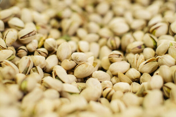 Bunch of white pistachios in supermarket. Healthful uncooked nuts in grocery. Superfood, healthy eating, assortment. Stock Picture