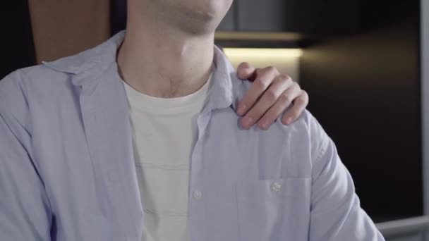 Unrecognizable man taking hand of male partner on his shoulder. Portrait of Caucasian gay couple expressing love and tenderness indoors. Lgbt, equality, lifestyle, romance. — Stock Video