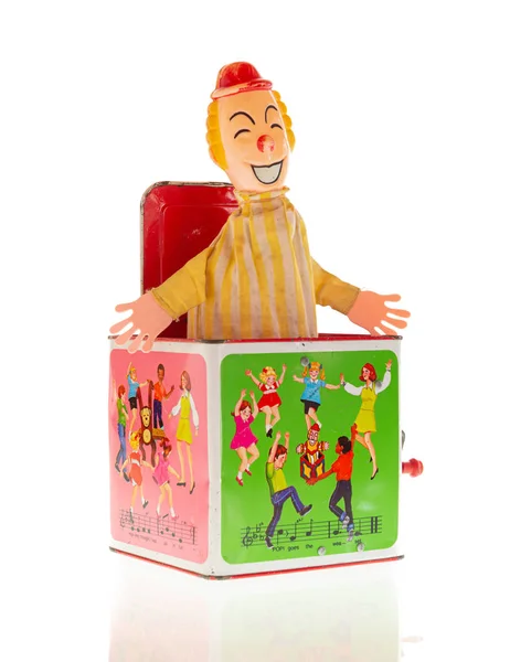 Vintage leksak clown Jack-in-the-box. Vit bakgrund. — Stockfoto