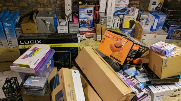 Various appliance and product boxes stored in home attic. — Stock Photo, Image