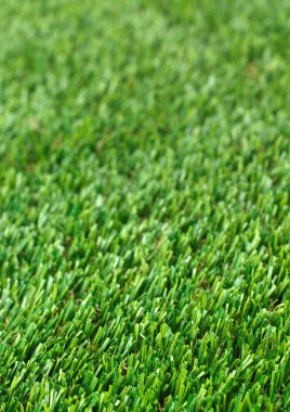 Dikey huylu yeşil çim golf alanı kağıt arka plan