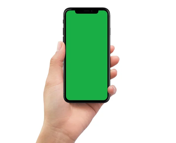 Human left hand holding black mobile smartphone with green scree — Stock Photo, Image