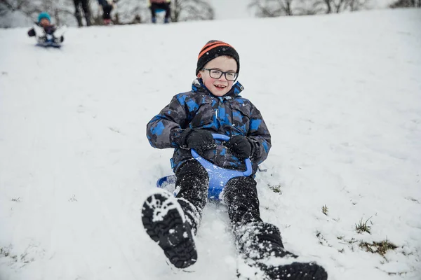 Little Boy Smiling Camera While Sliding Hill Sled — Stock Photo, Image