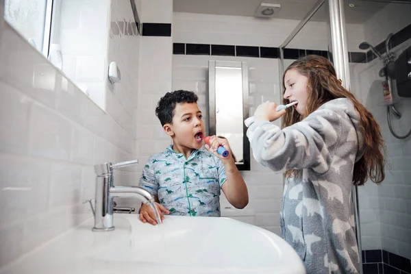 Little Boy His Older Sister Brushing Teeth Together Bathroom Home — Stock Photo, Image