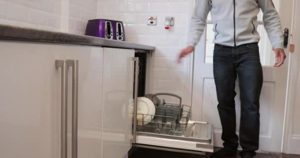 Mid Adult Man Filling Dishwasher Kitchen His Home Help His — Stock Video