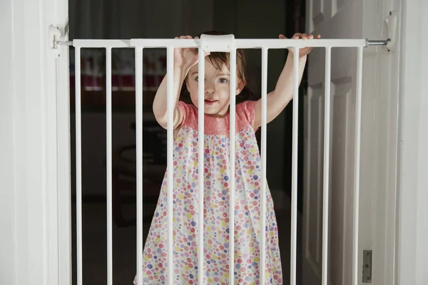 Front View Little Girl Standing Other Side Baby Saftey Gate — Stock Photo, Image