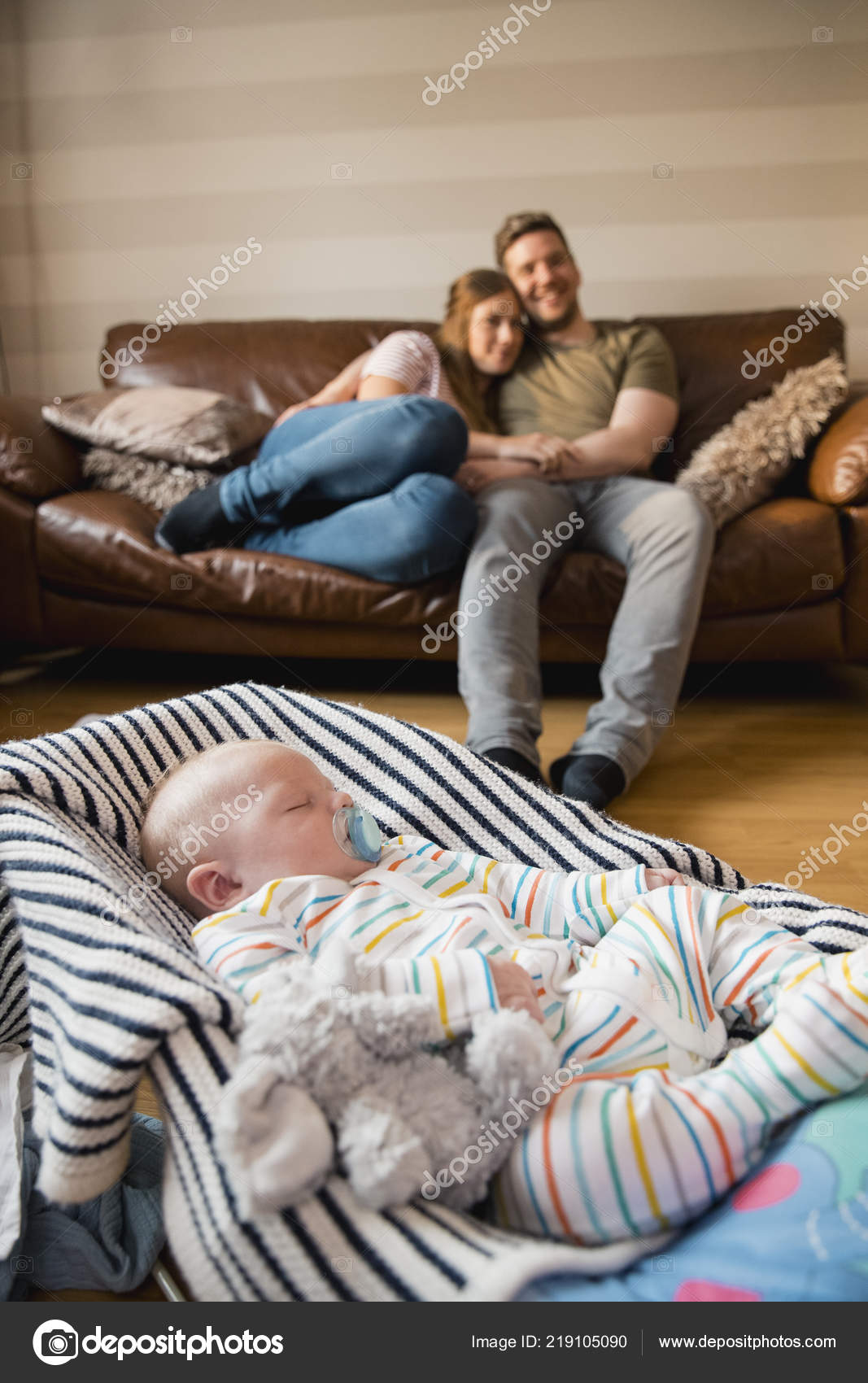 Husband Wife Sitting Watching Enjoying Some Peace Quiet While Newborn Stock Photo by ©DGLimages 219105090 picture