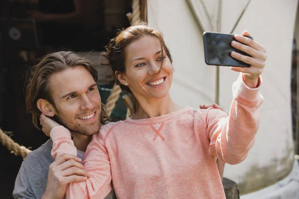 Mid Adult Couple Sitting Looking Smiling Smart Phone Take Selfie — Stock Photo, Image