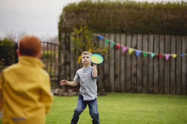 Two Young Boys Playing Back Garden Throwing Tennis Ball Each — Stock Photo, Image