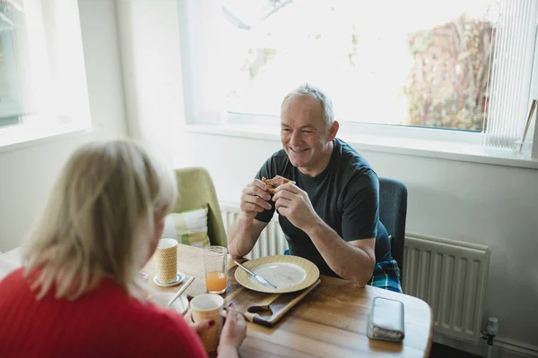 Senior Man Laughing Talking His Partner While Enjoy Breakfast Together — Stock Photo, Image