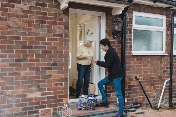 Teenage Boy Delivering Groceries His Grandmother — Stock Photo, Image