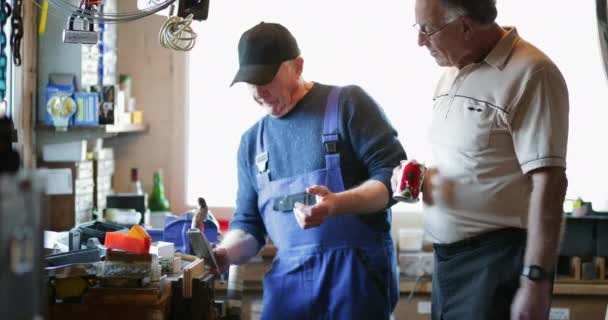 Two Senior Men Construction Workshop One Man Explaining Something Other — Stock Video