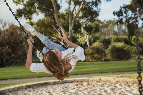 Teenage Girl Playing on the Swings in the Park — Stock Photo, Image