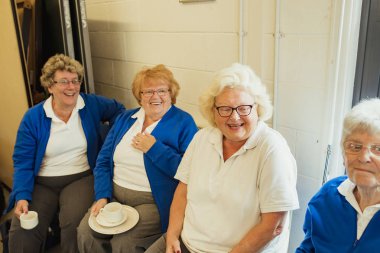 Senior Women Having Coffee clipart