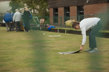 Placing the Lawn Bowling Mat clipart