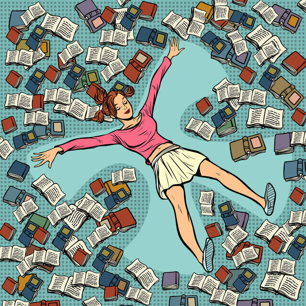 молодая девушка делает снежного ангела в книгах
