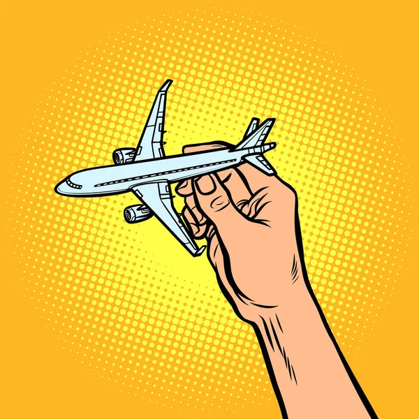 Літак у руці. метафора подорожей і туризму — стоковий вектор
