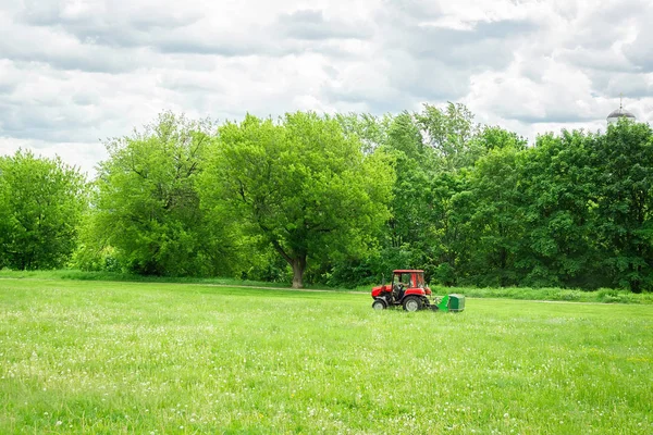 tractor lawn mower mows grass