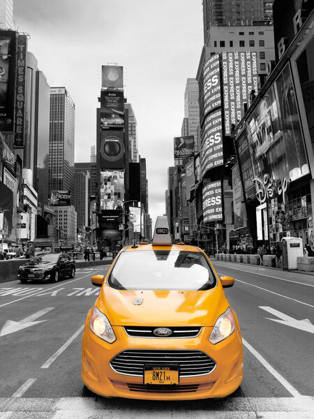 New York City, USA - April 2018: Yellow taxi selective colour in Times Square