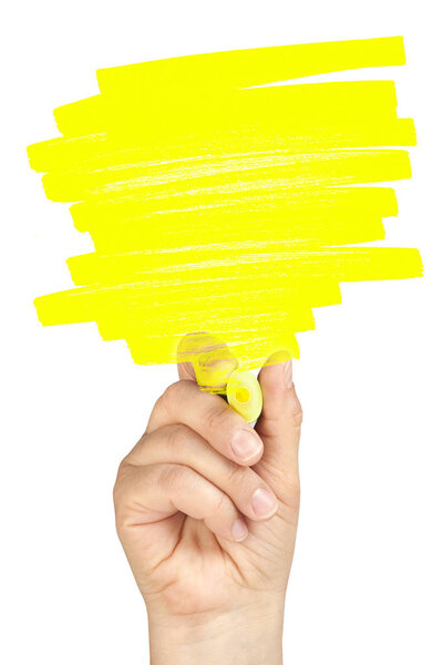 Hand highlighting with yellow highlighter portion for text on clear glass whiteboard