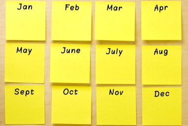 Blank calendar yellow postit notes affixed on a wooden board clipart