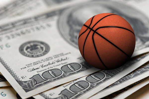 basketball ball on 100 dollars bills closeup