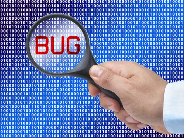 Magnifying glass in hand on digital background detecting bug — Stock Photo, Image