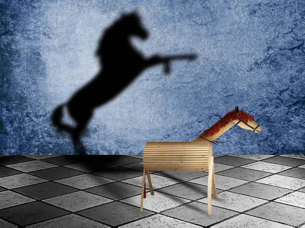 Toy wooden horse with shadow as a wild horse on a chessboard. Potentiality concept