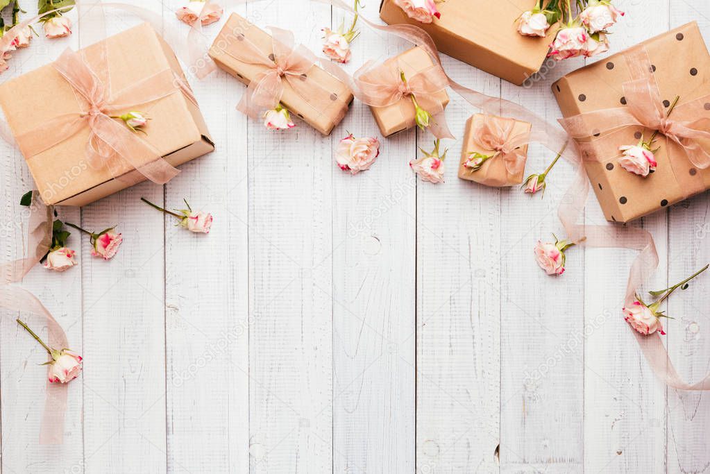 Flat lay composition with gift boxes wrapped in kraft paper