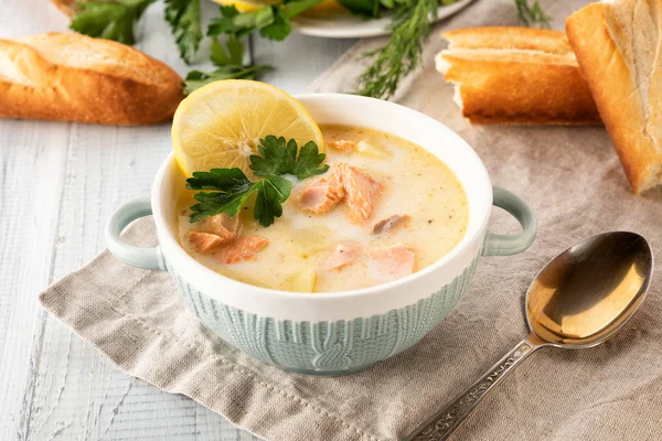 Finnish creamy soup with salmon, potatoes, onions, and carrots — Stock Image Finnish creamy soup with salmon, potatoes, onions, and carrots Stock Image