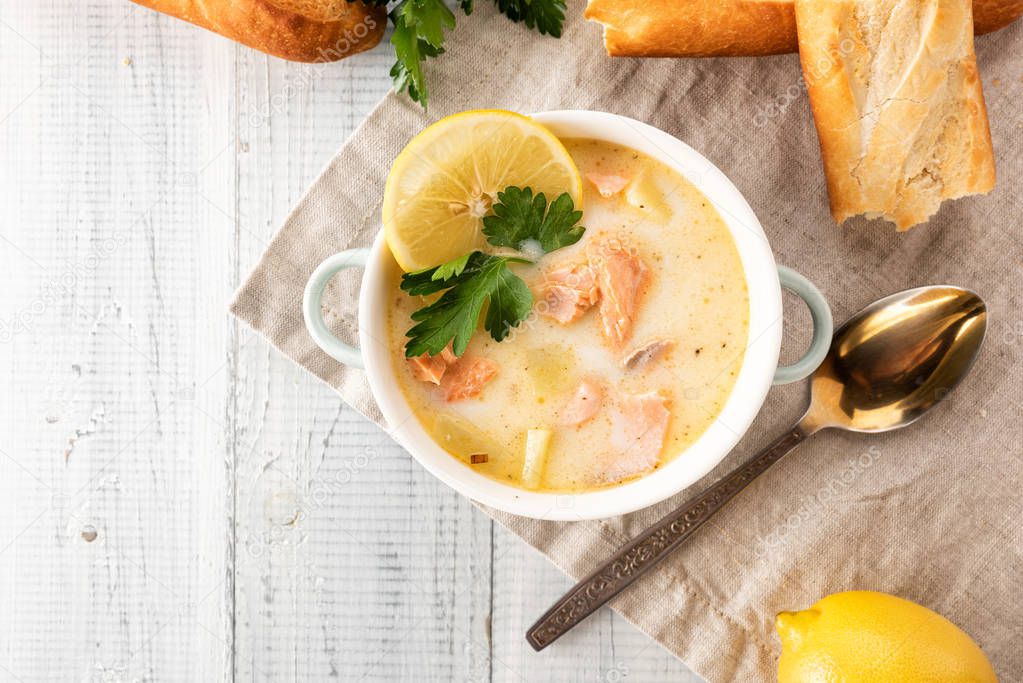 Finnish creamy soup with salmon, potatoes, onions, and carrots 