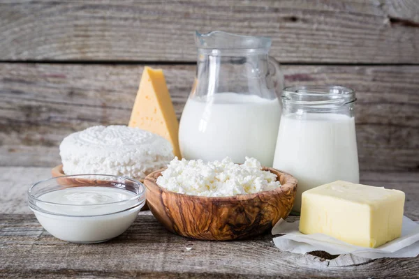 Selection of dairy products on rustic wood background — Stock Photo, Image