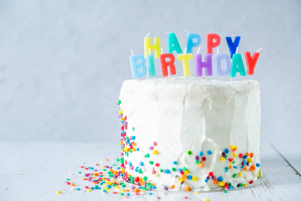 Colorful birthday concept - cake, candles, presents, decorations